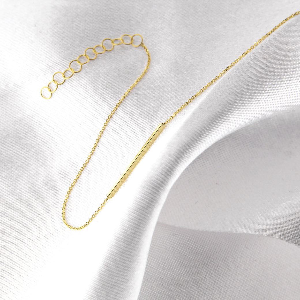 Złota bransoletka z patyczkiem